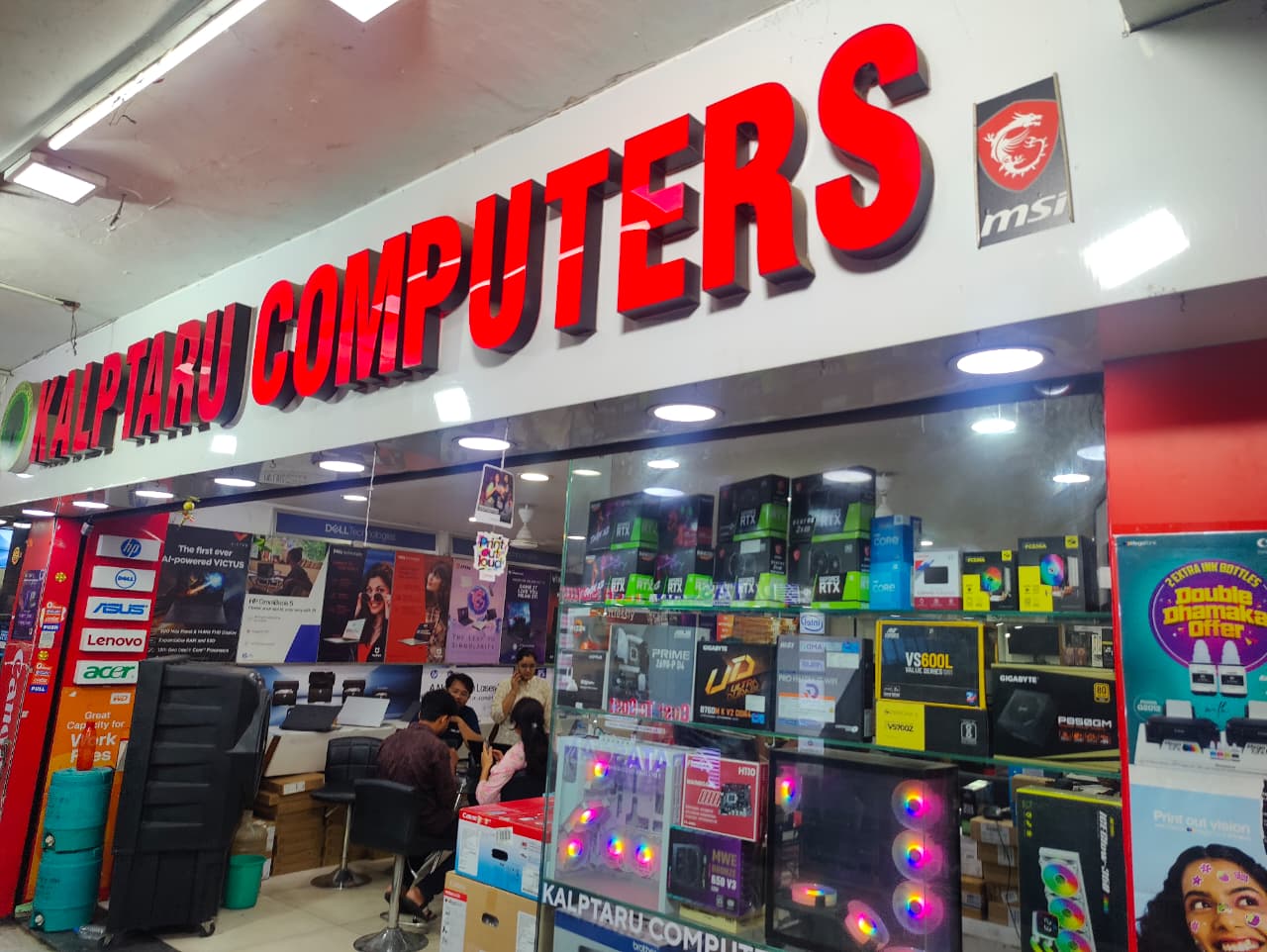 Kalptaru Computers red signage above HP, Dell, ASUS, Lenovo and Acer brand pillars